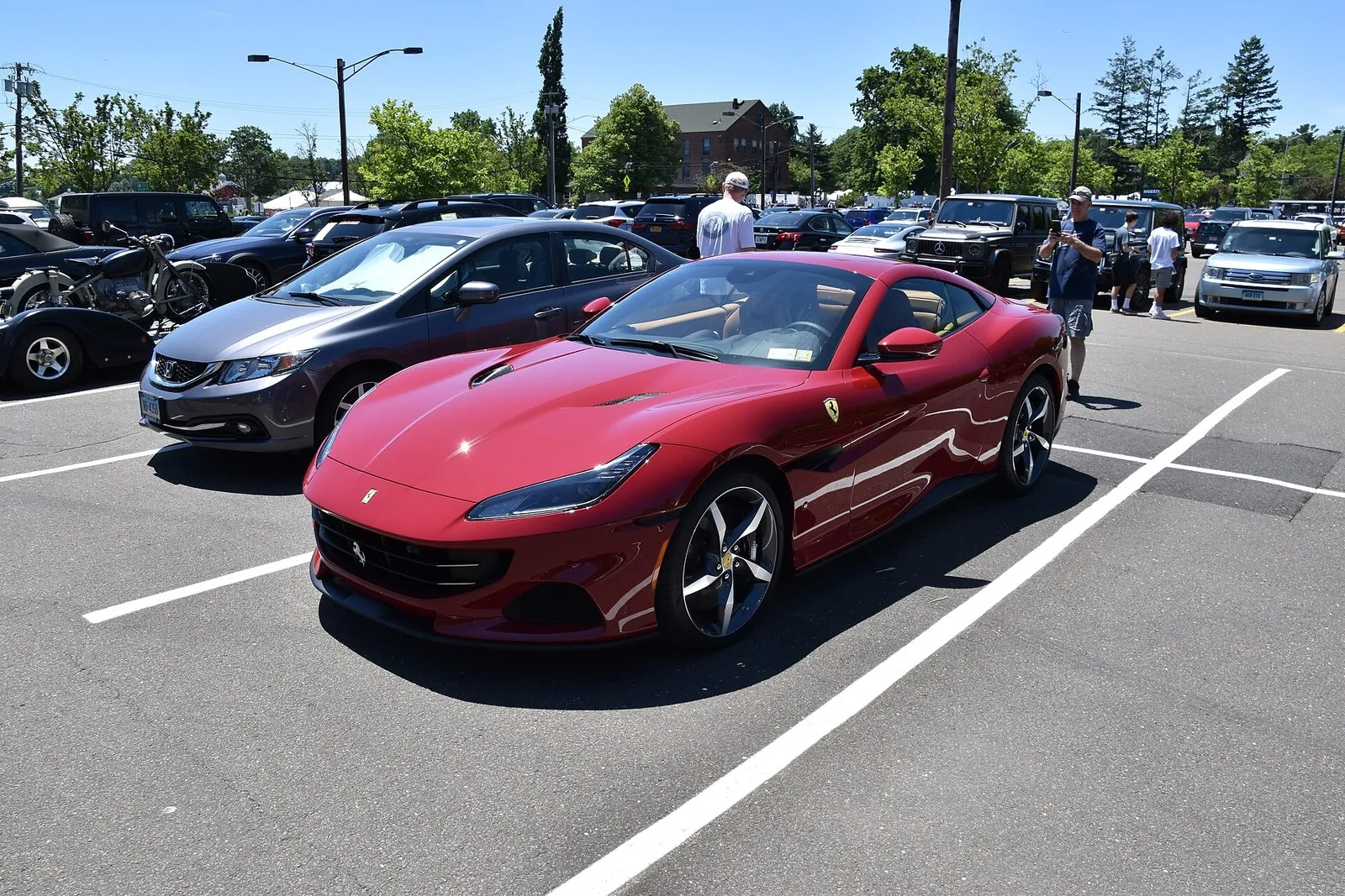 Red Ferrari Portofino M with roof closed, front three-quarter view